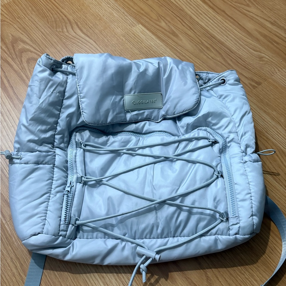 Yoga light blue puffer Backpack with Bungee Cord